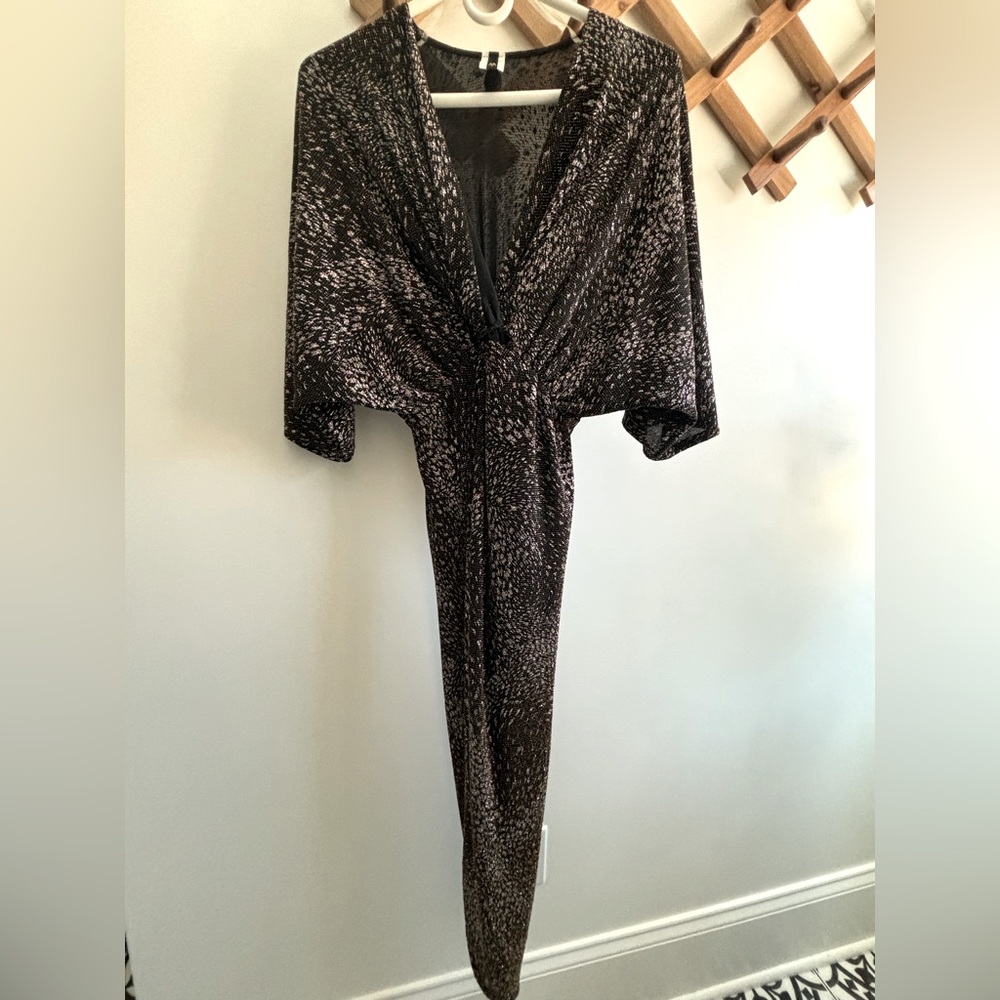 Glittery dress. Blackish brown. Flowy top. Long in the back with front slit